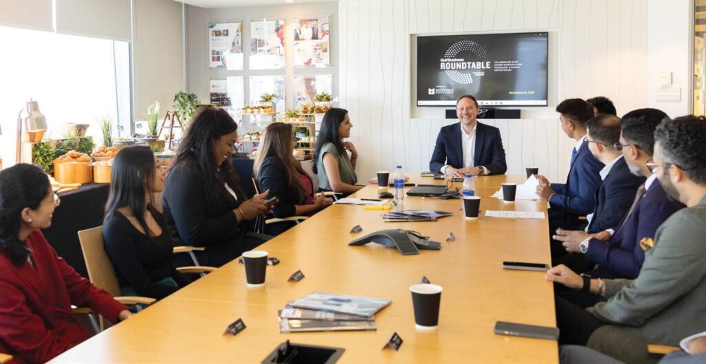 Business strategy meeting with laptops for Lumina Group UAE blog on Dubai business growth strategies